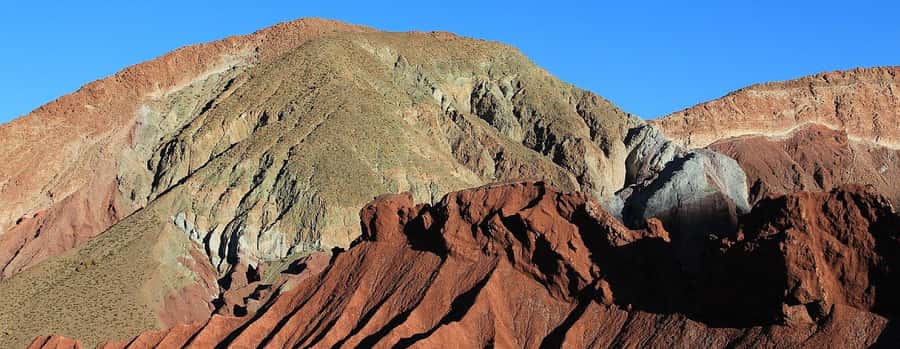 San Pedro de Atacama: Rainbow Valley & Good Herbs Tour - Entering the colored hills
