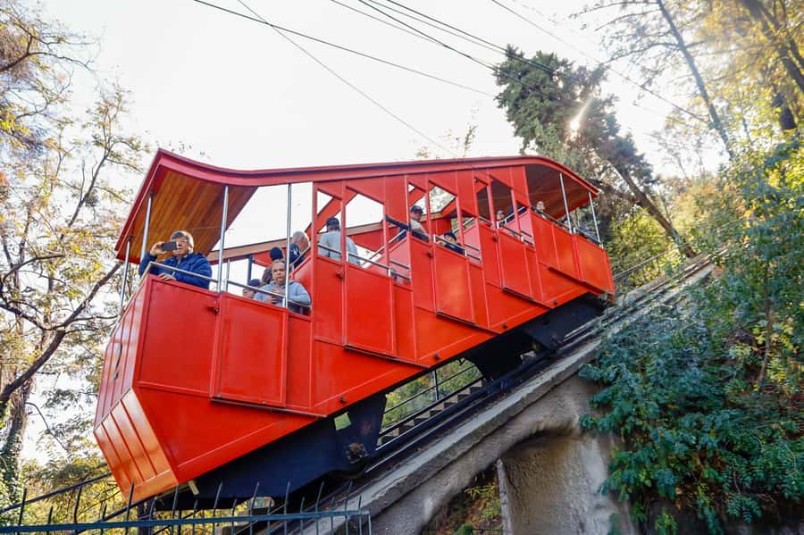 Santiago: 1-Day Hop-On Hop-Off Bus and Cable Car Ticket - Aviation Plaza follows the Mapocho River